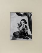 A gelatine silver photographic print of a female sitter, mounted, 26cm x 21cm. (Likely attributed to