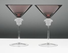 A pair of Rosenthal 'Versace' Medusa head martini glasses, amethyst pink colour, boxed.