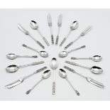 A collection of Geo V silver teaspoons and dessert forks, with fancy finials, maker L & C