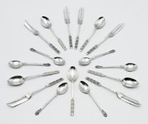 A collection of Geo V silver teaspoons and dessert forks, with fancy finials, maker L & C