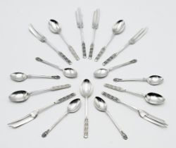 A collection of Geo V silver teaspoons and dessert forks, with fancy finials, maker L & C