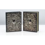 Two address books each with ornate silver embossed covers, 14cm x 11cm