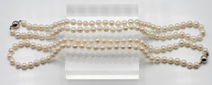 Two matching pair of single row uniform cultured pearl necklaces, approx. length: 46cm, pearl