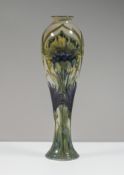 William Moorcroft, Florian ware, cornflower skittle vase, circa 1902. height 24cm