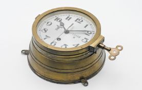 A WWII Third Reich Nazi German Kriegsmarine U-boat bulkhead clock with key, No15988, 20cm diameter.