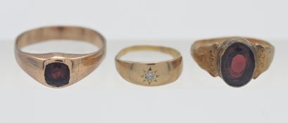 Three stone set rings, no hallmarks (3).