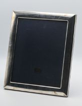 A large sterling silver photo frame, with cloth easel back, 31cm x 26cm, slight damage to top of