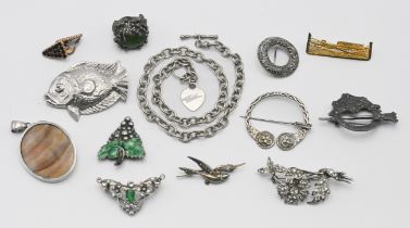 A small collection of jewellery to include silver brooches, pendant, a Celtic brooch etc.