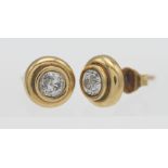 A pair of 18ct yellow gold and diamond stud earrings, approx. 0.20ct each.