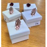 Swarovski Atelier, Collection of five rings, three rose gold coloured and two silver with mauve