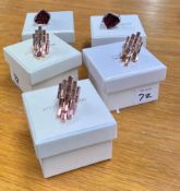 Swarovski Atelier, Collection of five rings, three rose gold coloured and two silver with mauve