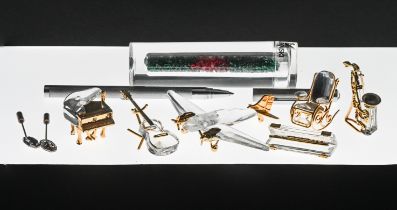 Swarovski Crystal Glass, Collection of eleven small items to include Saxophone, Harmonica, Guitar,