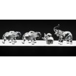 Swarovski Crystal Glass, Collection of four small Elephants, boxed. One Elephant is damaged.