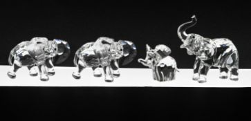 Swarovski Crystal Glass, Collection of four small Elephants, boxed. One Elephant is damaged.