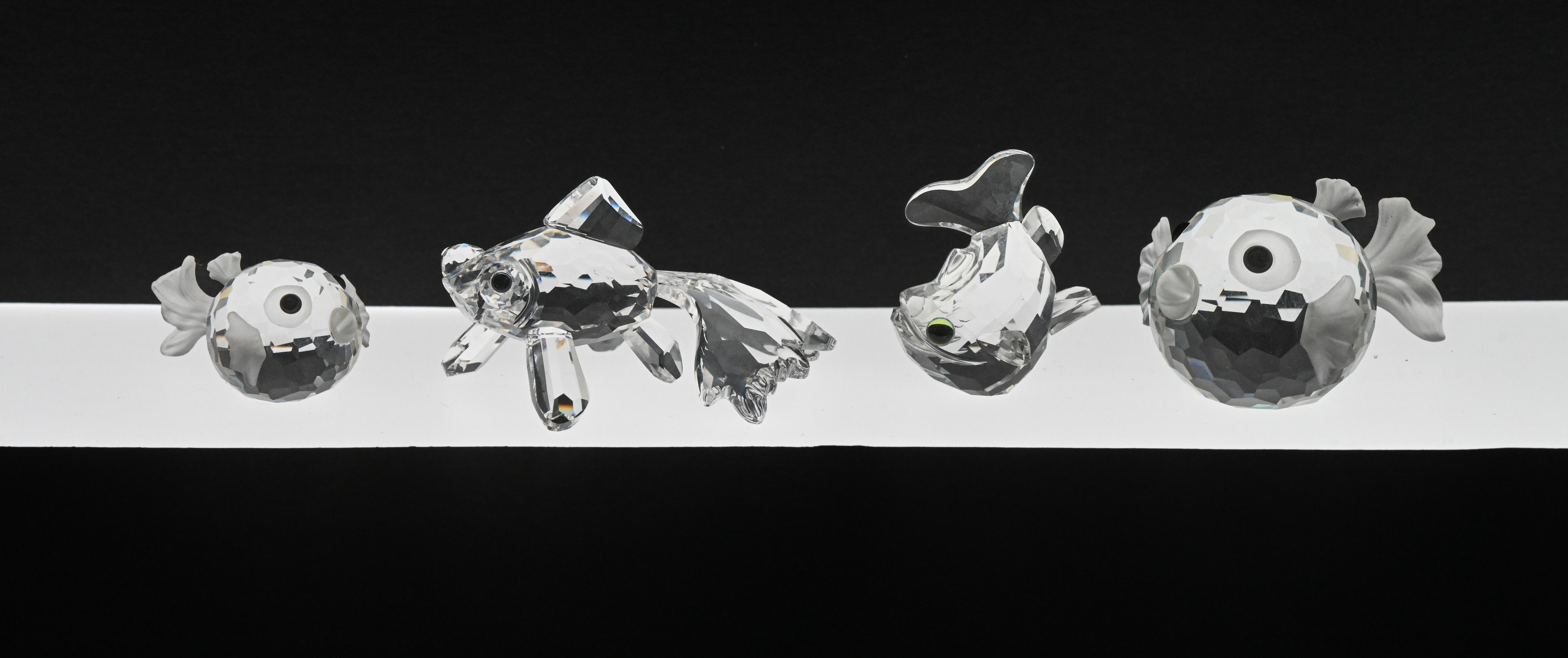 Swarovski Crystal Glass, collection of four Fish, boxed.