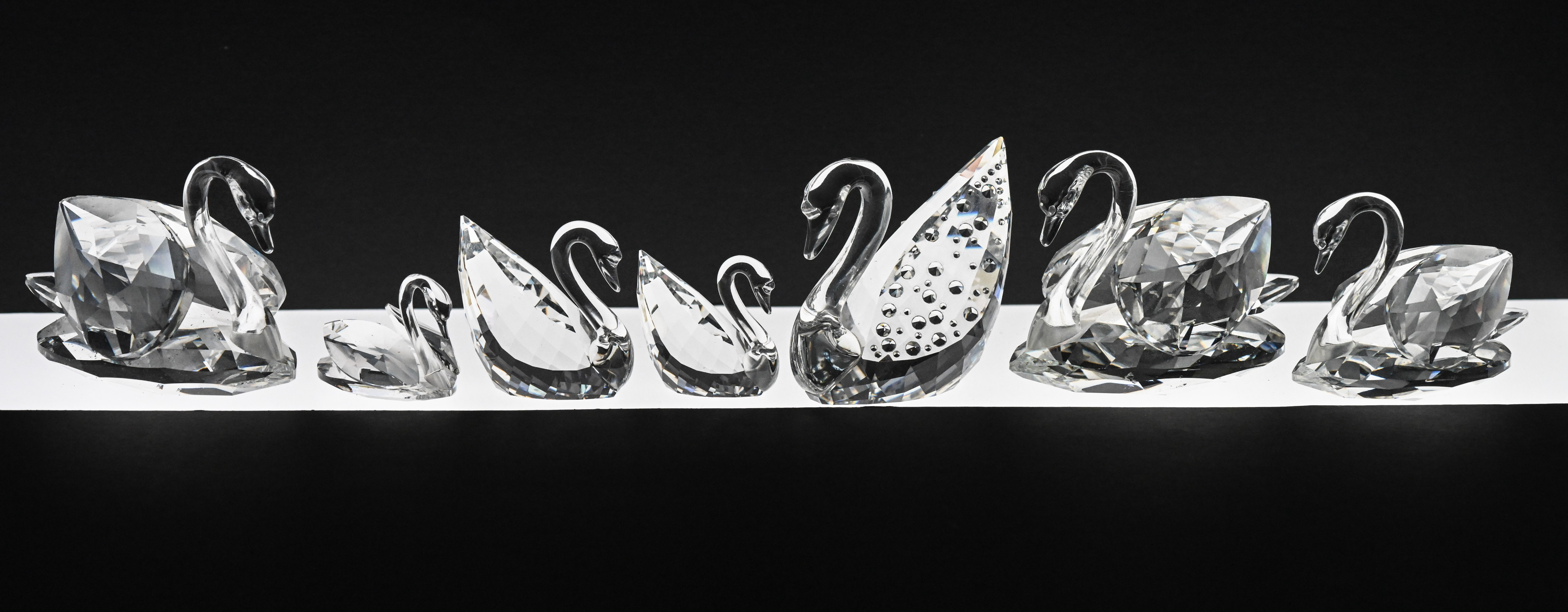 Swarovski Crystal Glass, Collection of seven assorted Swans, boxed.