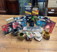 An assortment of seventeen Star Wars items including six plastic mugs, two key rings, Darth Maul