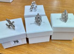 Swarovski Atelier, two silver closed rings and two silver open rings