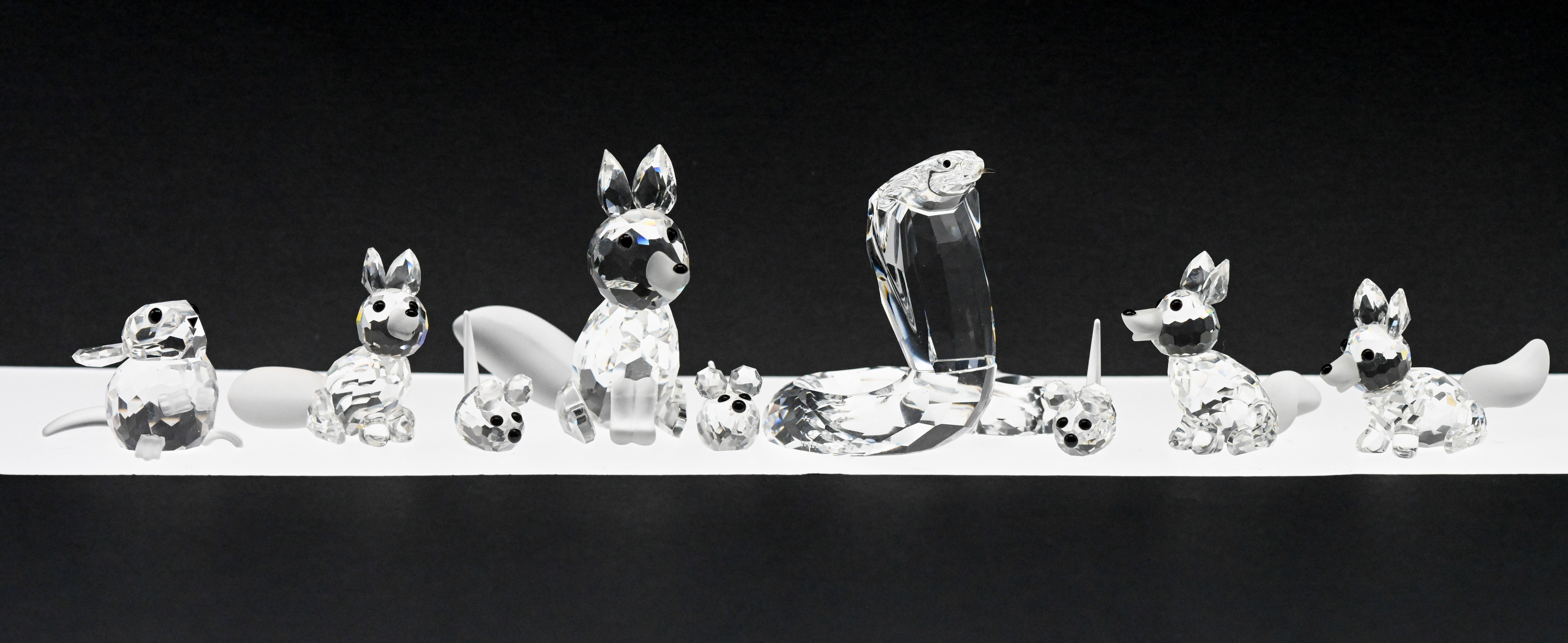 Swarovski Crystal Glass, Collection of seven animals to include 'Cobra', 'Mice' and 'Foxes', boxed.