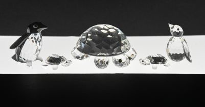 Swarovski Crystal Glass. Two Turtles and two Penguins, boxed.