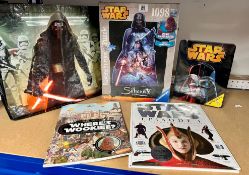 A collection of Star Wars related items including one Ravensburger puzzle, one Make your own AT-ST