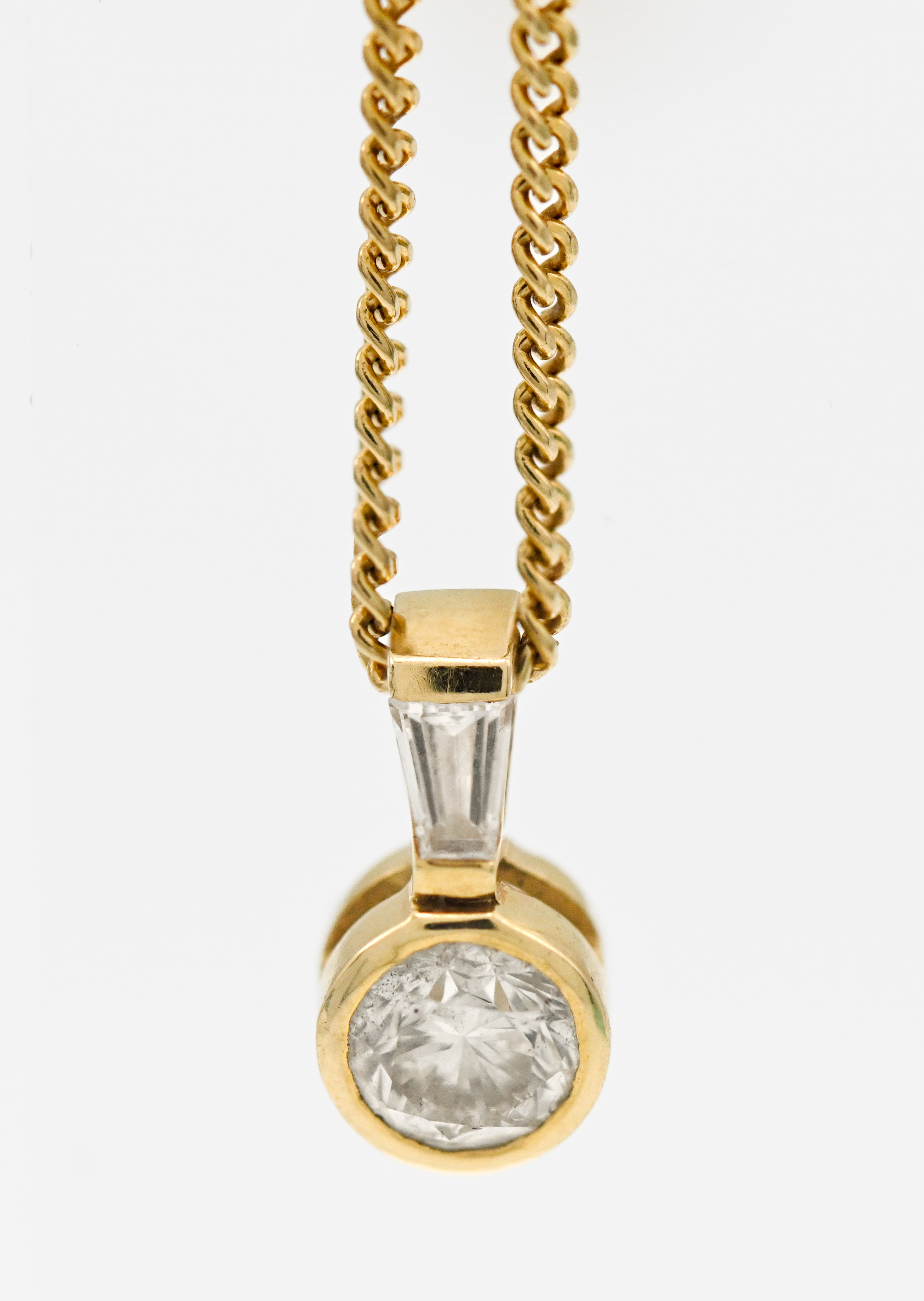 An 18ct yellow gold single stone diamond pendant, approx. 0.20ct.