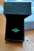 An 18ct yellow gold diamond and emerald ring, size Q.