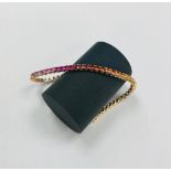 An 18ct rose gold multi coloured sapphire bracelet, length 18cm.