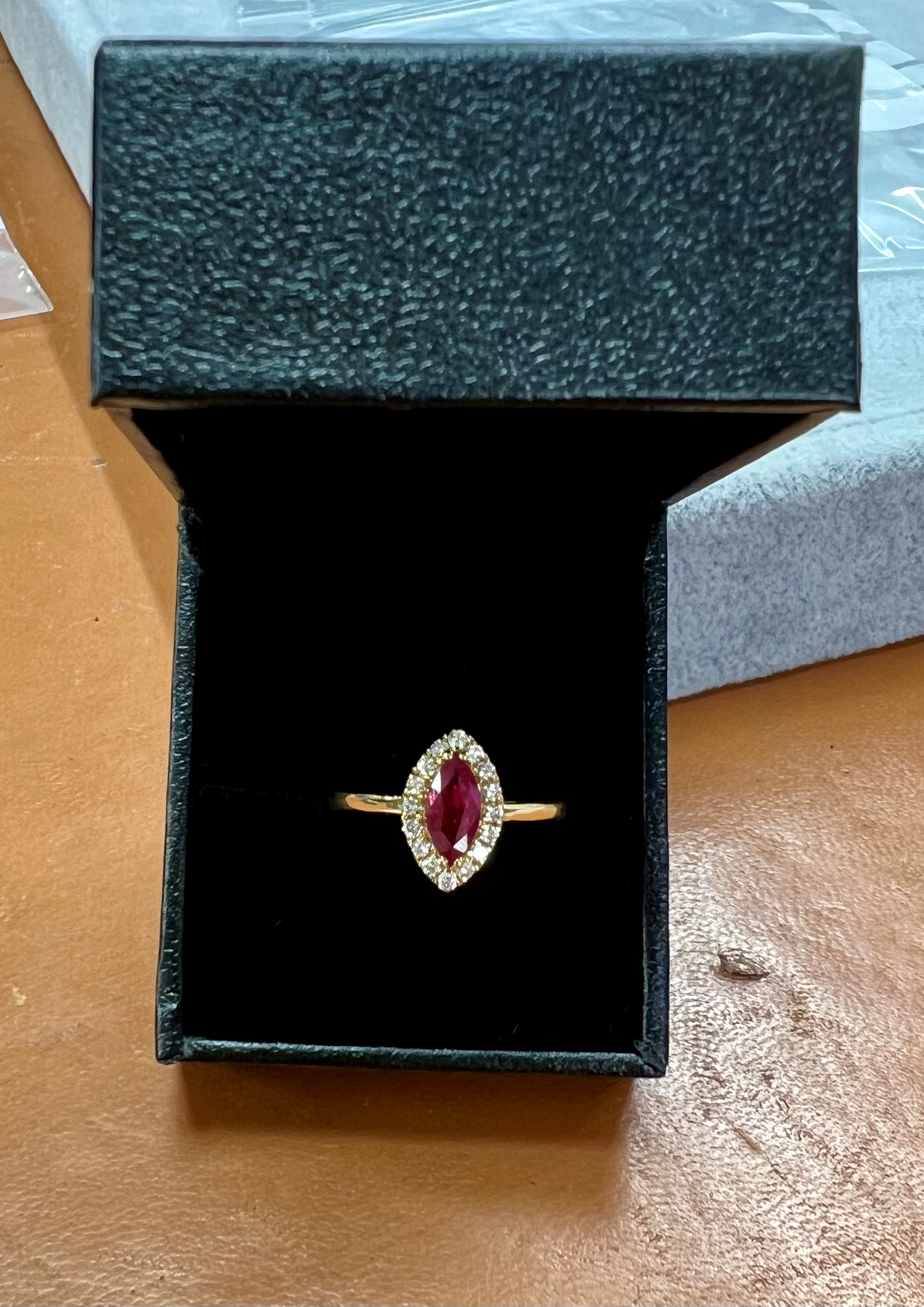 An 18ct yellow gold diamond and ruby ring, size Q.