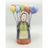Studio Pottery Figure of the Balloon Seller, signed to base, height 22cm