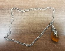 Silver mounted amber pendant with silver chain