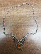 Silver mounted Amber pendant and necklace.