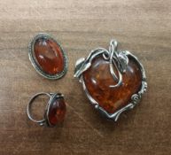 Silver mounted Amber jewellery comprising large heart shaped pendant, ring and oval brooch. (3)