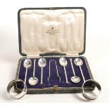 Silver set of dessert spoon & tongues and pair silver serviette rings, 98g.