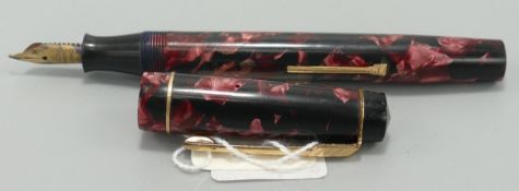 A Croxley 'The Croxley Pen' lever fill fountain pen in red marble