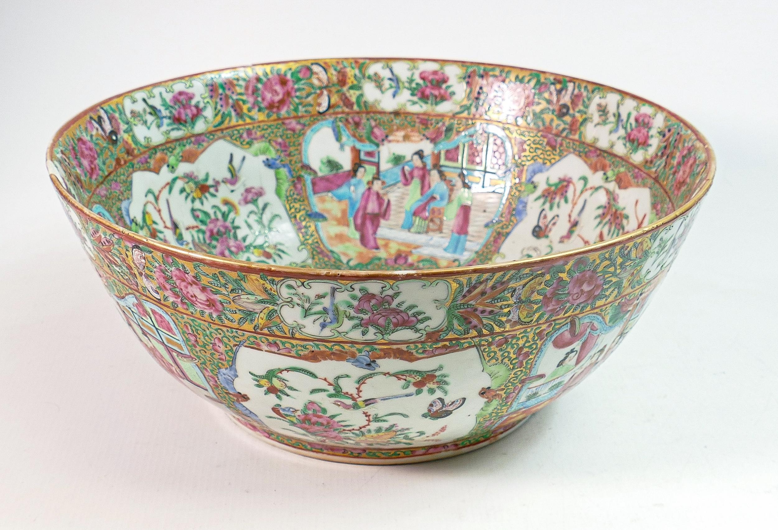 Early 19th century Chinese Canton enamelled punch bowl, decorated with court scenes, foliage &