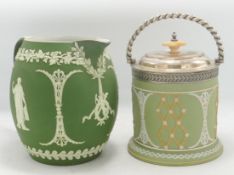 Wedgwood Tri Colour 19th Century Tea Caddy & Dark Green Relief decorated jug, tallest 17cm(2)