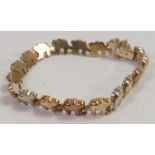 9ct three coloured gold elephant bracelet, 9.4g.