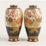 Pair of early 20th century Japanese Satsuma vases, decorated with foliage & birds, height 15.5cm. (