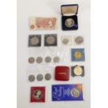 A collection of coins including commemorative coins, 2 10 shilling notes, etc