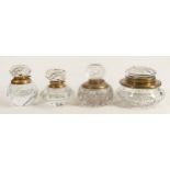 Four heavy glass crystal inkwells with brass fittings, tallest 10cm. (4)