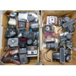 A collection of camera equipment to include Polaroid SX-70 Land camera, Agifold bellows camera,