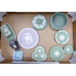 A collection of Multi Coloured Wedgwood items to include lidded boxes, lilac plate, pin dishes etc