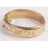 9ct ct gold bangle with metal core, gross weight 26.8g, dented.