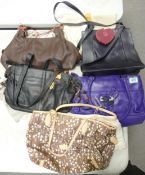 A collection of used Radley Ladies Handbags, 3 dust bags & matching purse (5)