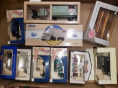 A collection of boxed di-cast vehicles