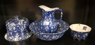 A collection of Burleigh Ware Calico patterned items to include cheese dome/bell, jelly mould,