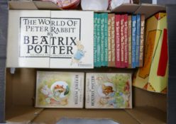 A collection of Beatrix Potter Related books, some boxed