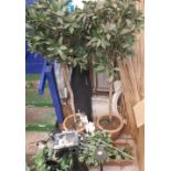 A collection of decorative items to include artificial trees and plants, vases etc.