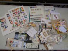A large collection of loose World stamps and stamp albums (Viewing highly recommended).